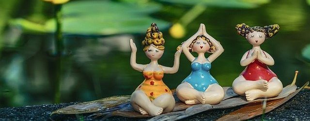 3 ceramic girls sitting in the forest meditating